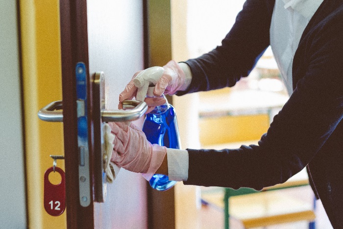 iStock-1225026694 - teacher cleans door